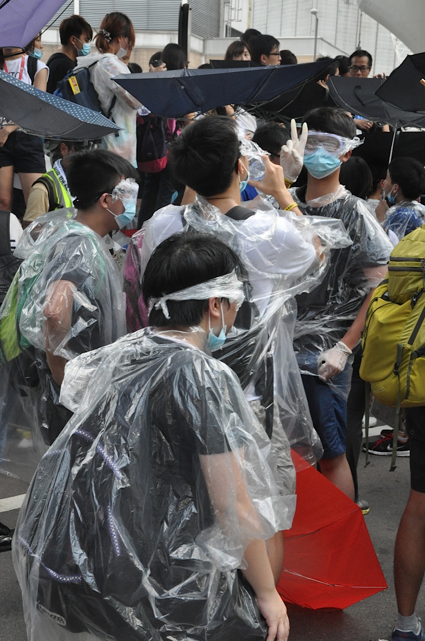 Protesters cover themselves in ...