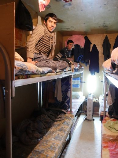 Moscow, Russia – Labor migrants from Tajikistan in a container on a building site on the outskirts of Moscow. The container, where the migrants live, is shared with eight fellow countrymen. Image by Iris Oppelaar. 