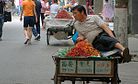 Chinese Street Vendor Staged Death Foiled when “Corpse” Had to Get a Drink