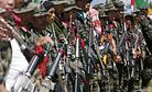Philippine Muslim Rebels Begin Turning Over Weapons, Soldiers 