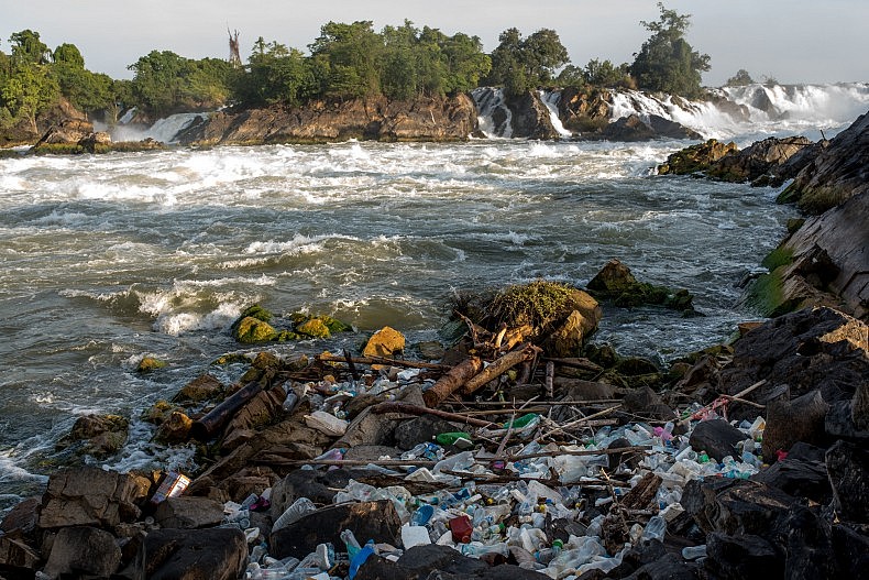 Plastic bottles and other waste from the upstream tourist destination of Si Phan Don (4000 islands) collects below the Khone Phapheng waterfalls. Photo by Luc Forsyth.