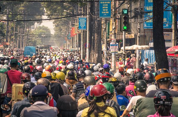 People Crossing Street In The Busy Streets Of Hanoi, Vietnam Stock
