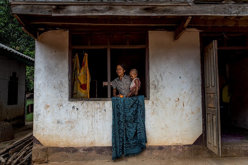 A woman and her baby in the village of Khoc Kham. Photo by Luc Forsyth.