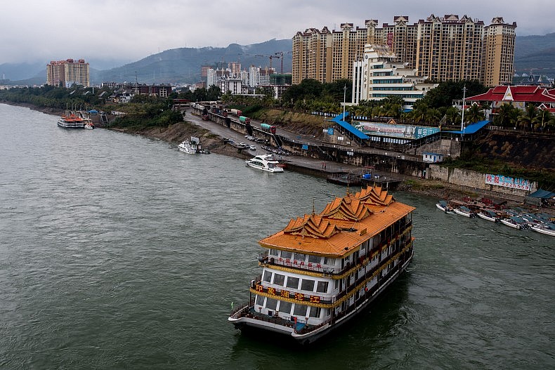 A floating restaurant and leisure ship floats down the Lancang (Mekong) in Xishuangbanna, Yunnan, China. Photo by Luc Forsyth.