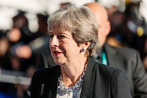 Theresa May to Visit China Ahead of Trump’s Visit to Britain