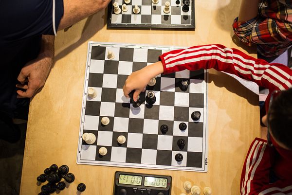 Local chess player helps team win state title