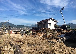 Japan Flood Recovery Efforts Hampered by Heat Wave