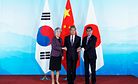 China Urges Dialogue During Trilateral Meet With Japan, South Korea
