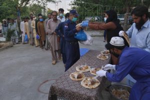 Volunteers distribute free food to daily wage workers and others for breaking their fast on the second day of Ramadan, in Islamabad, Pakistan, April 26, 2020.

Credit: AP Photo/Anjum Naveed