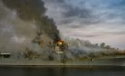 US Amphibious Assault Ship Burns in Port for Second Day
