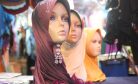 Social Reformers Challenge Malaysia’s Islamic Hardliners Over Headwear