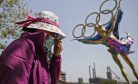 China Keeps Virus at Bay at High Cost Ahead of Olympics