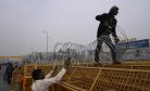 Police Tear Gas Indian Farmers Marching to New Delhi