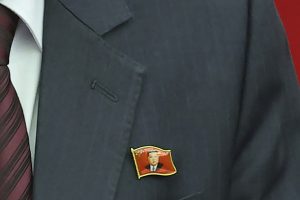 North Koreans Are Seen Wearing Kim Jong Un Pins for the First Time